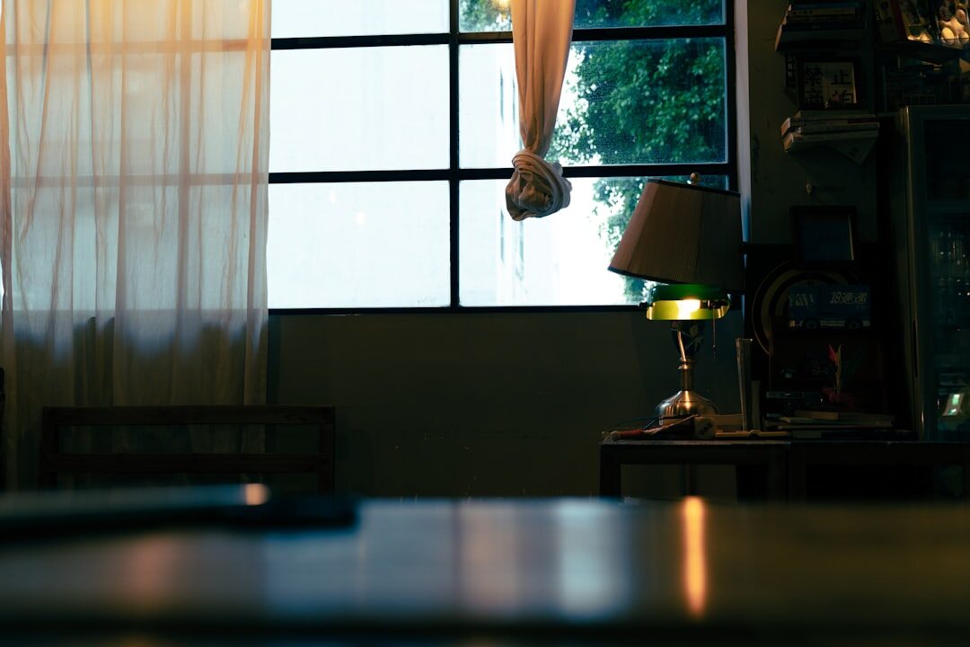 Editor reviewing photographic contact sheets at a light table