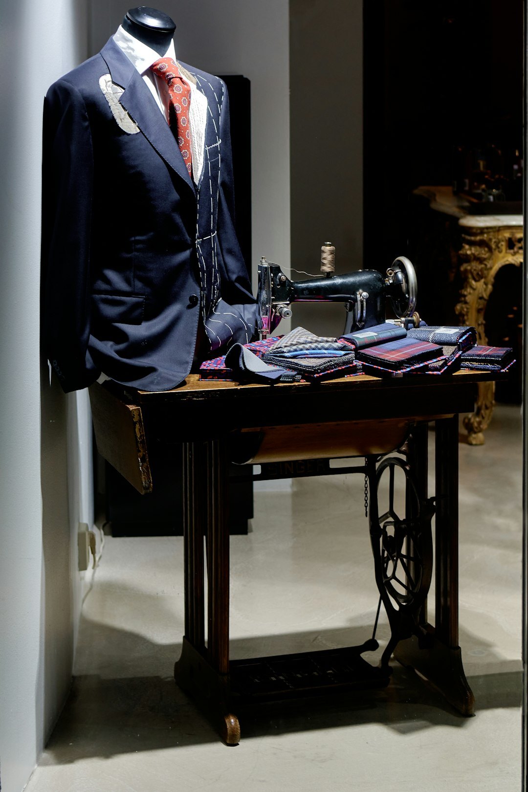 Fashion stylist arranging garments in an atelier